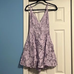 Women’s lavender criss cross back mini dress. Floral detailing. New with tags